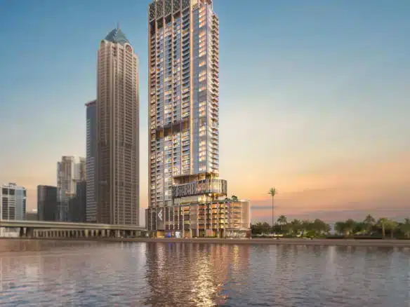 Modern 45-story One River Point tower by Ellington overlooking Dubai Water Canal with luxury apartments and infinity pools